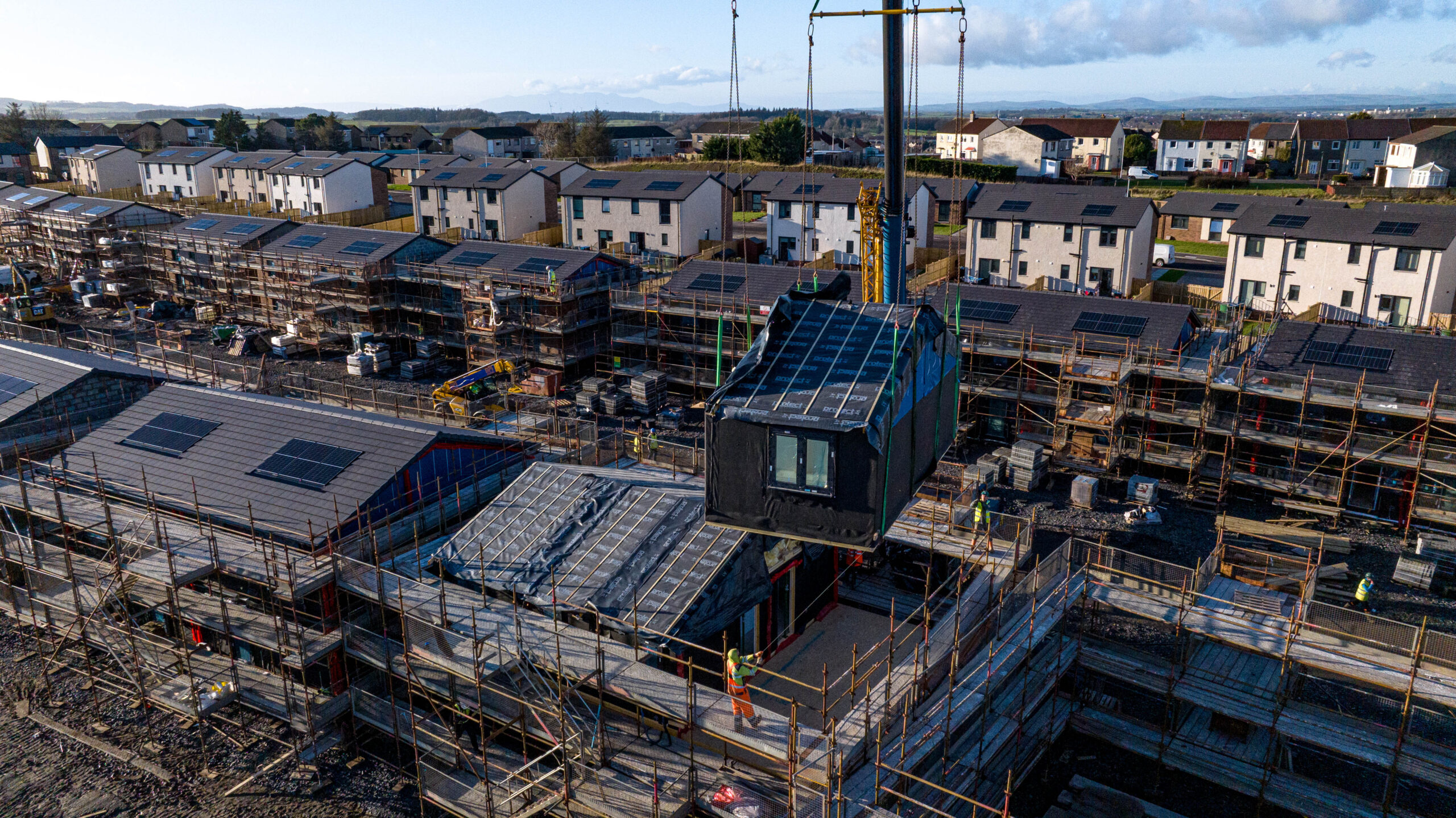 A Module is Craned Into Position On Connect Modular’s Affordable Housing Site in Kilmarnock